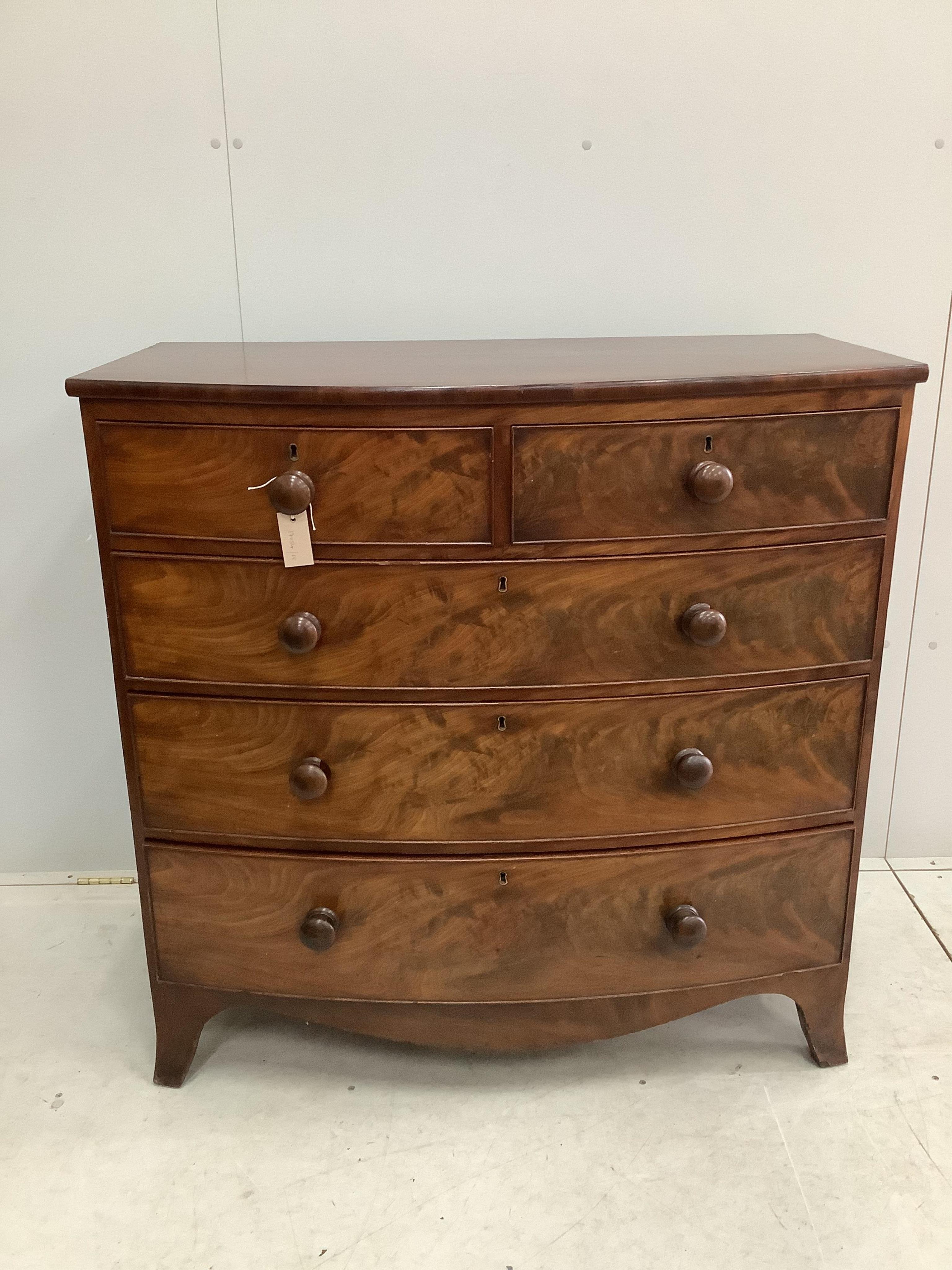 A Regency mahogany bow front chest of drawers, width 105cm, depth 52cm, height 104cm. Condition - fair